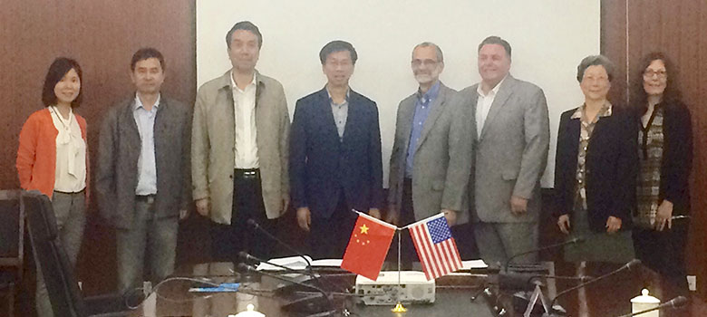 Former president and current board chair Victor Zhou, current president Wu Chundu to the left of Jeff Wagnitz. Lui Liu Director of International Exchange for YPU and Highline alum on left.